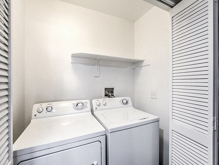 Apartment home washer and dryer closet at Deerwood, California, 92879